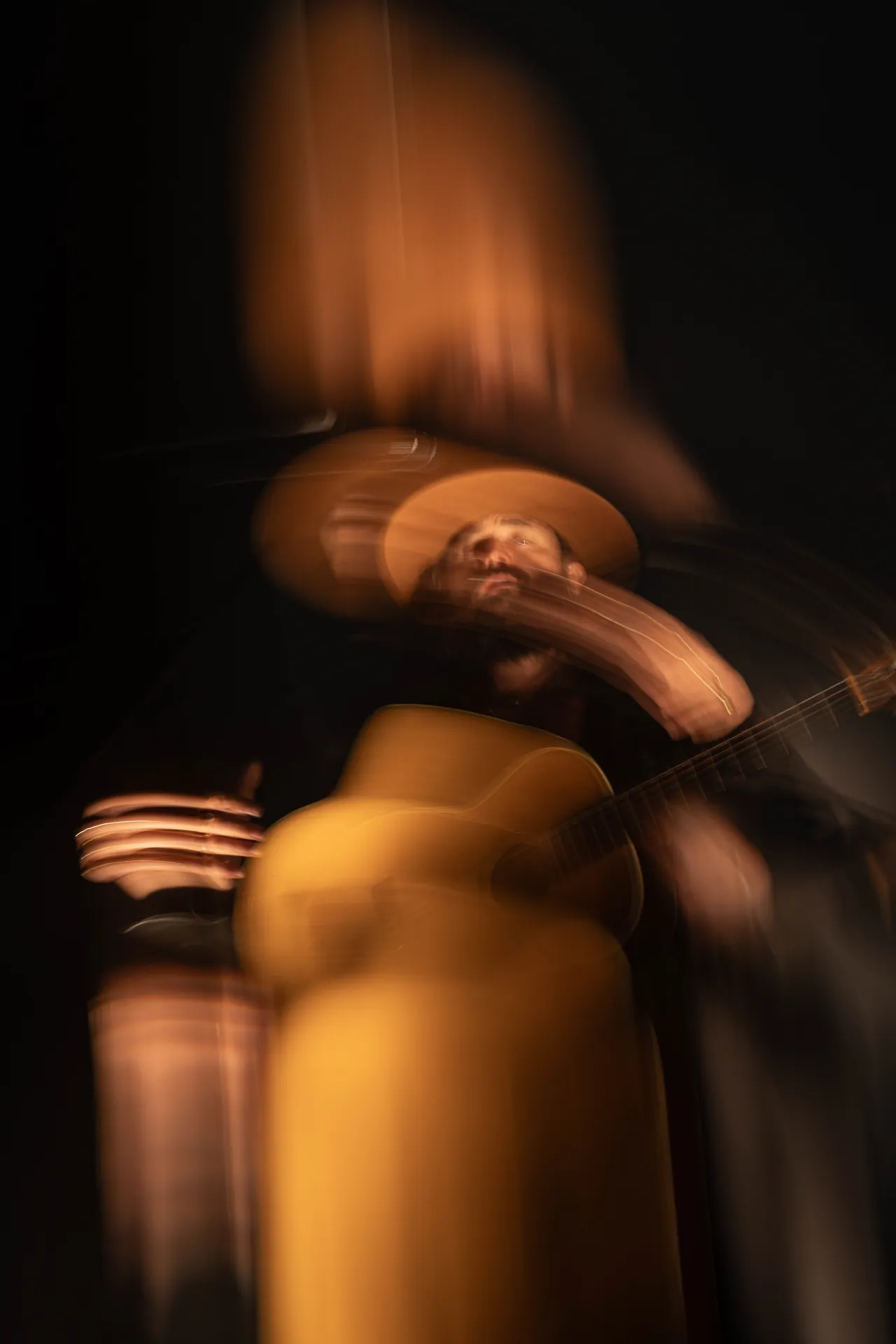 ry x, live performance, indie pop electronica artist, playing guitar with immersive lighting.