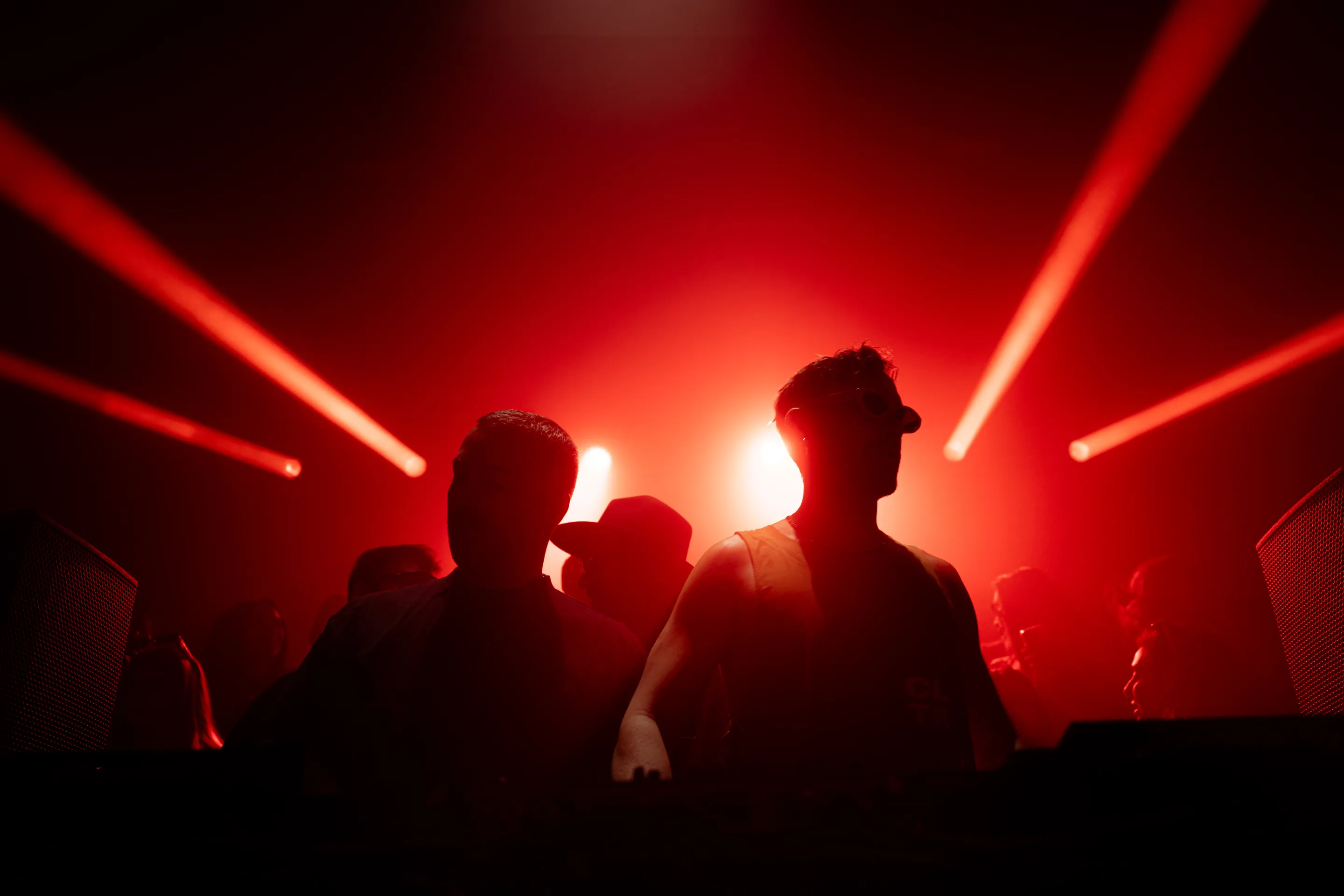 Live concert photography capturing musicians performing on stage with dynamic lighting and energetic crowd engagement.