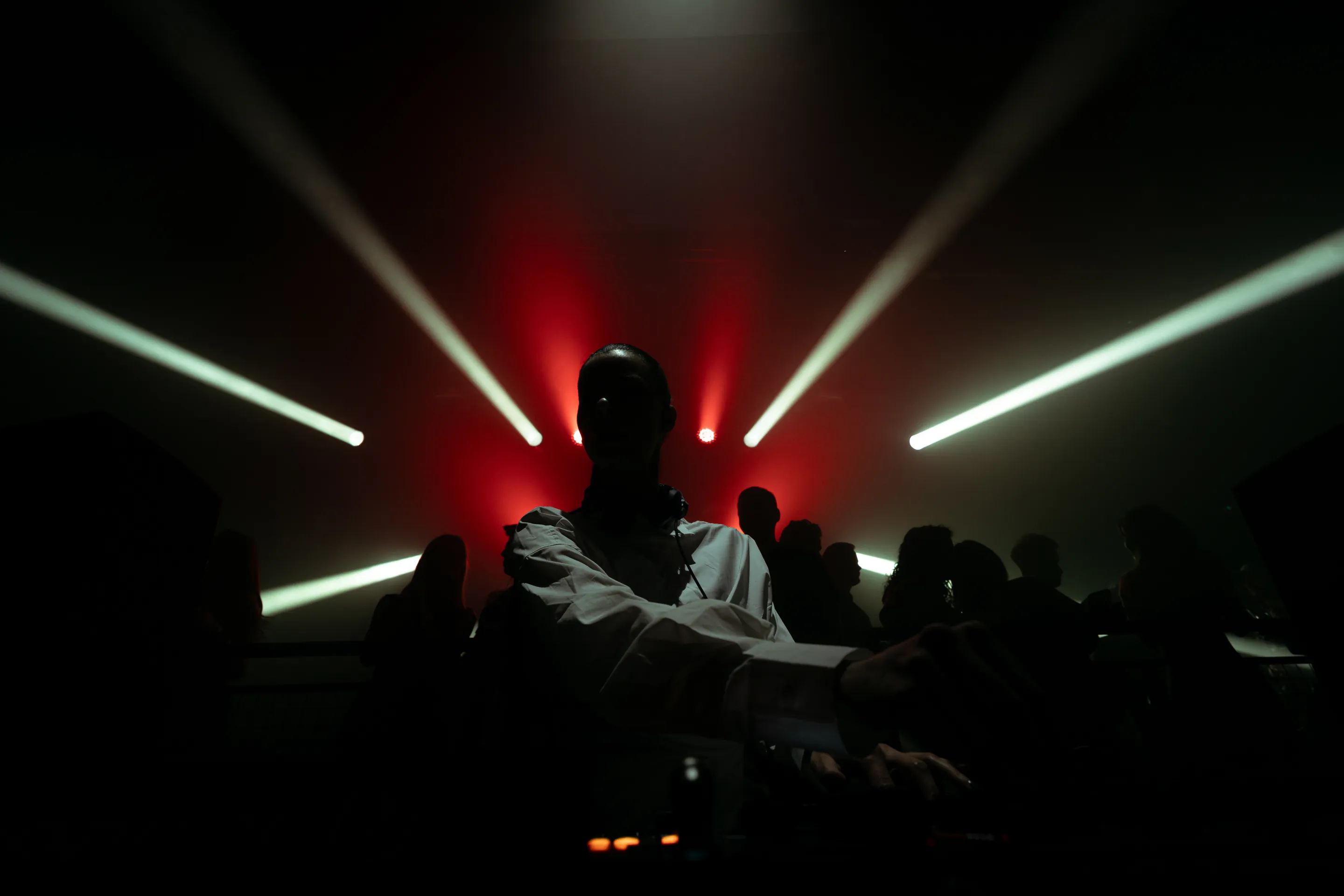 Live concert photography capturing musicians performing on stage with dynamic lighting and energetic crowd engagement.