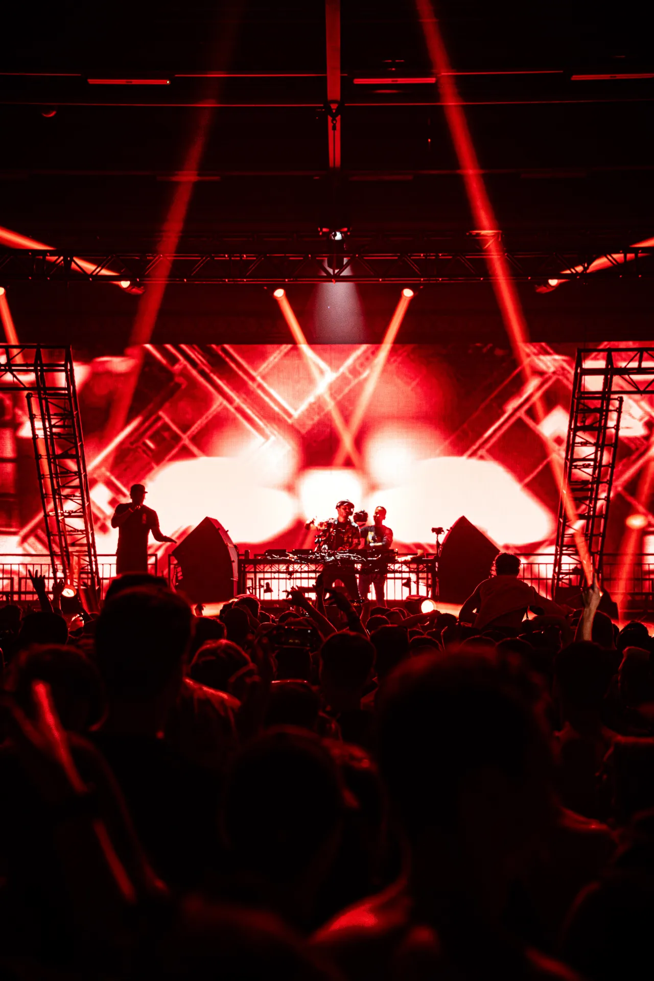 DJ set photography featuring immersive visuals, pulsating energy, and audience interaction at a music festival.